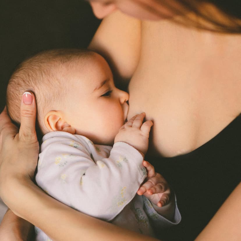 Parent holding a baby during a feeding support moment